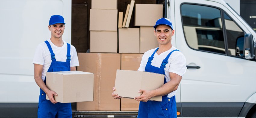 Professional interstate moving truck loading furniture for a long distance relocation from Longmont
